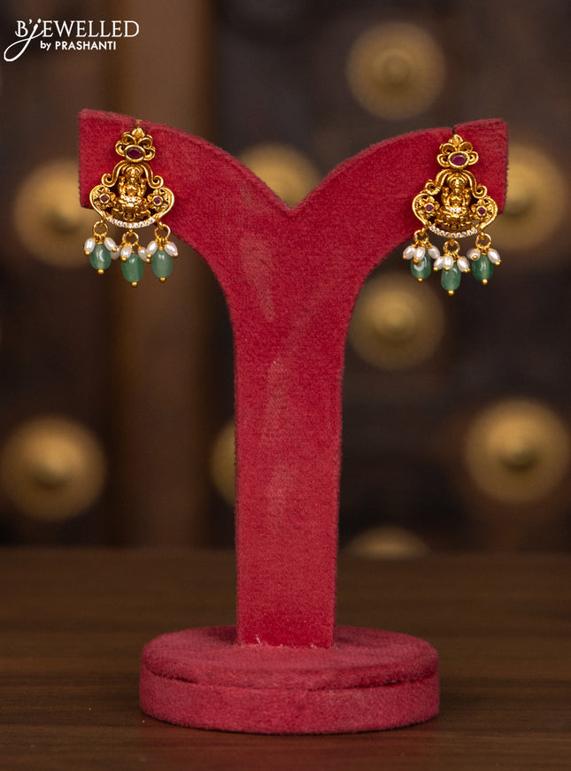 Antique haaram lakshmi pendant with pink kemp and cz stones in mint green beads hangings