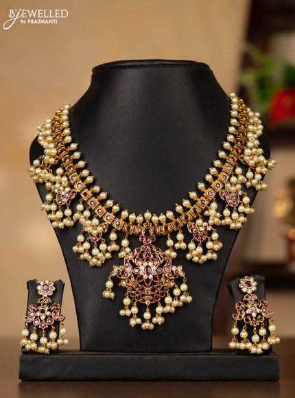 Antique guttapusalu necklace peacock design with pink kemp & cz stones and pearl hangings