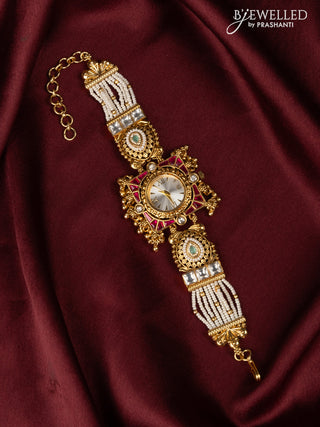 Watches with pink jadau kundan & mint green stones in golden beads hangings