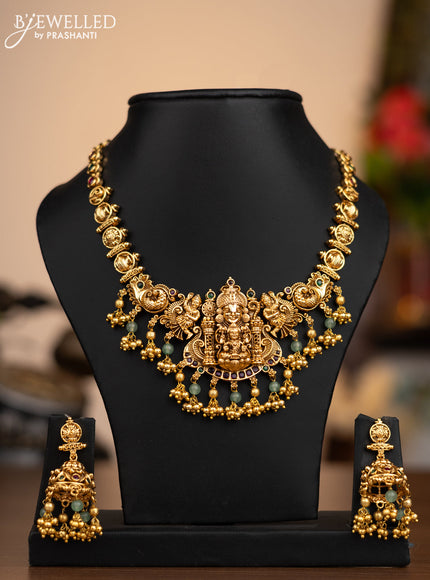 Antique necklace lakshmi pendant with kemp stones and green & golden beads hangings