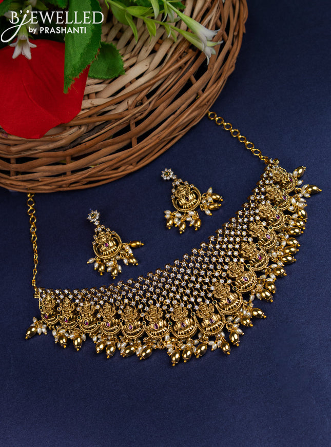 Antique choker lakshmi design with kemp & cz stones and pearl & golden beads hangings