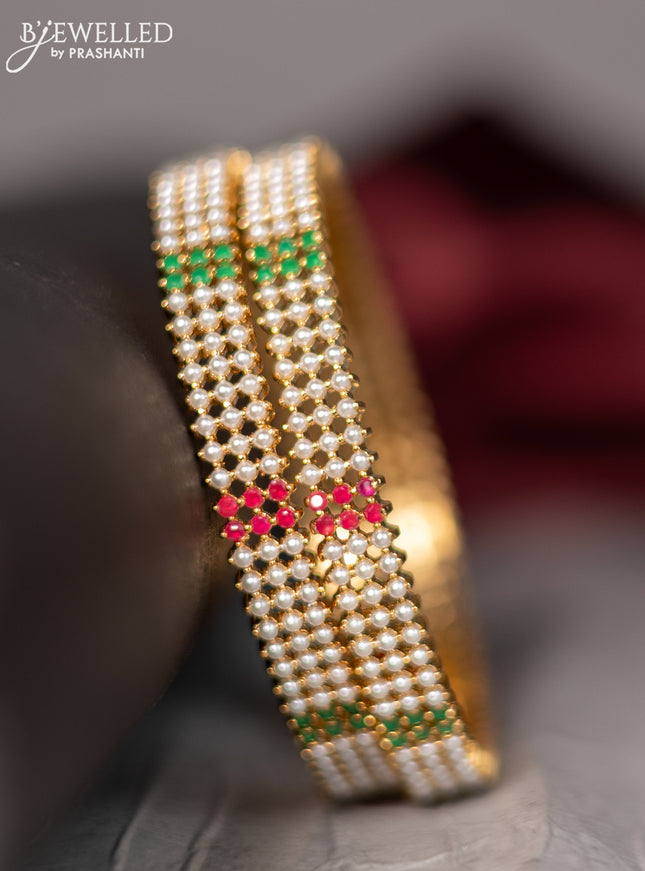 Pearl rajawadi bangle with pearls and kemp stones in gold finish