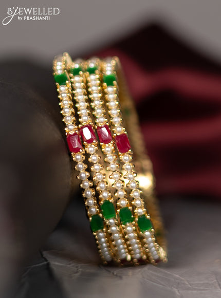 Pearl rajawadi bangle with pearls and kemp stones in gold finish
