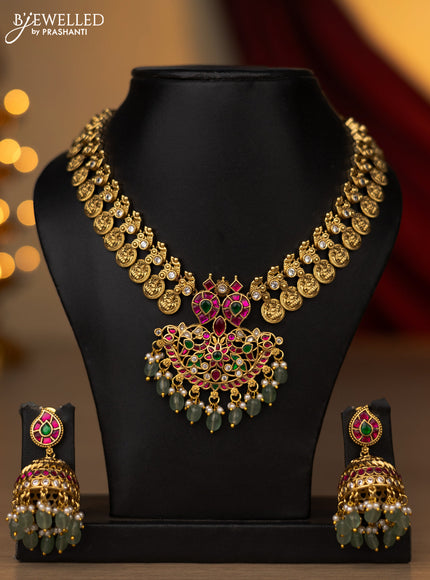 Jadau necklace lakshmi kasu design with jadau kundan stones and pearl & mint green beads hanging