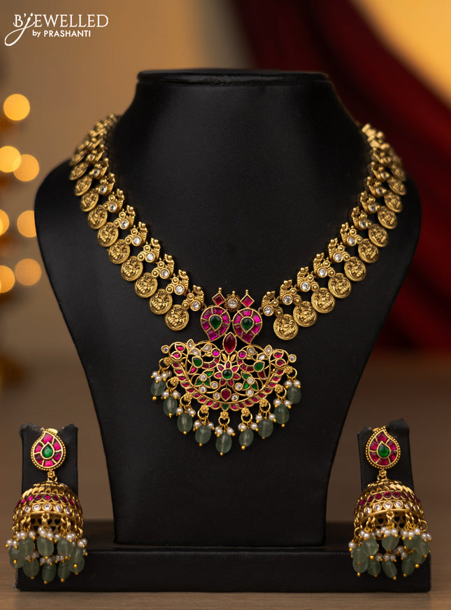 Jadau necklace lakshmi kasu design with jadau kundan stones and pearl & mint green beads hanging