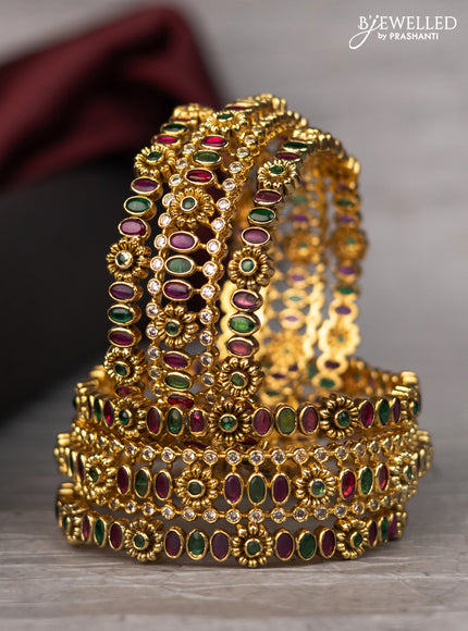 Antique bangle with floral design and kemp & cz stones