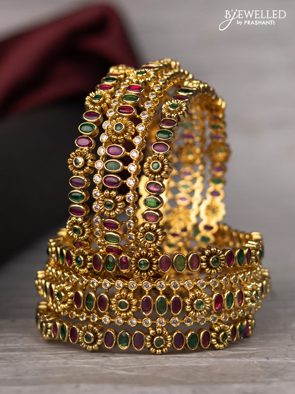 Antique bangle with floral design and kemp & cz stones