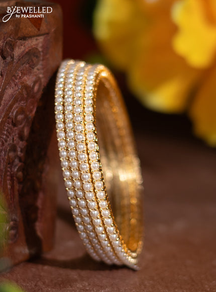 Pearl rajawadi bangle with pearls in gold finish