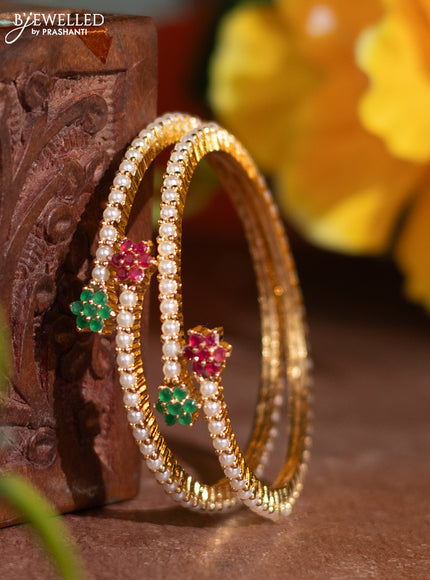 Pearl rajawadi bangle with kemp stones and pearls in gold finish