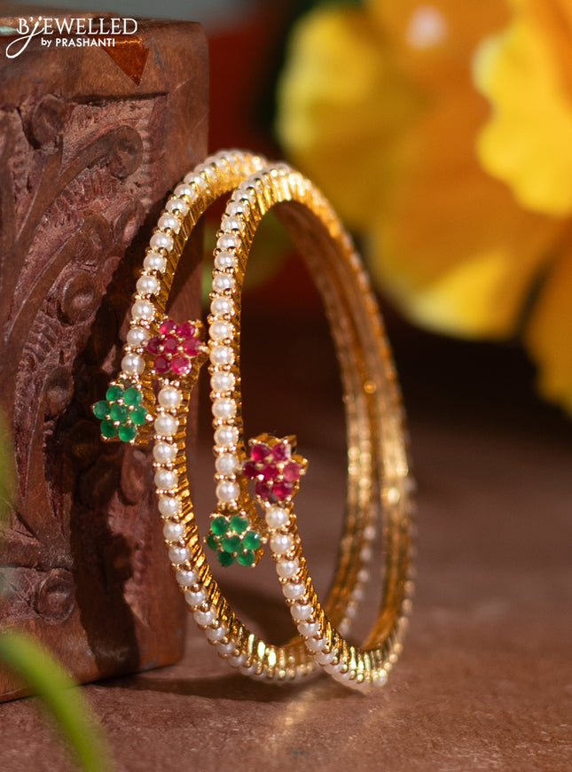 Pearl rajawadi bangle with kemp stones and pearls in gold finish