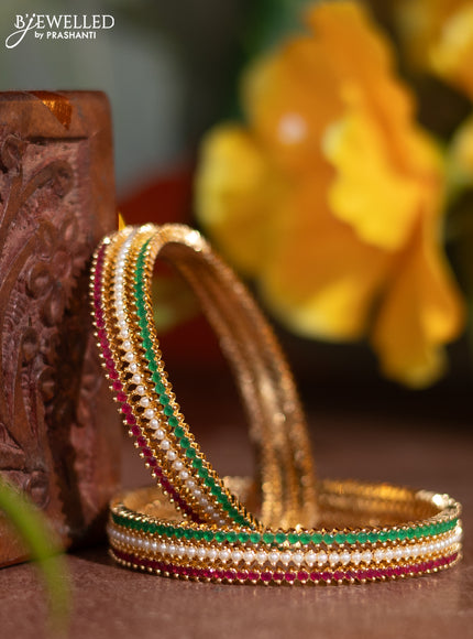 Pearl rajawadi bangle with kemp stones and pearls in gold finish