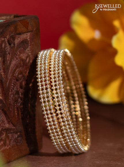 Pearl rajawadi bangles with pearls in gold finish