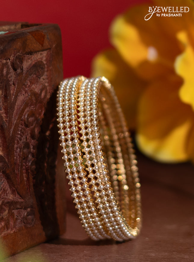 Pearl rajawadi bangles with pearls in gold finish