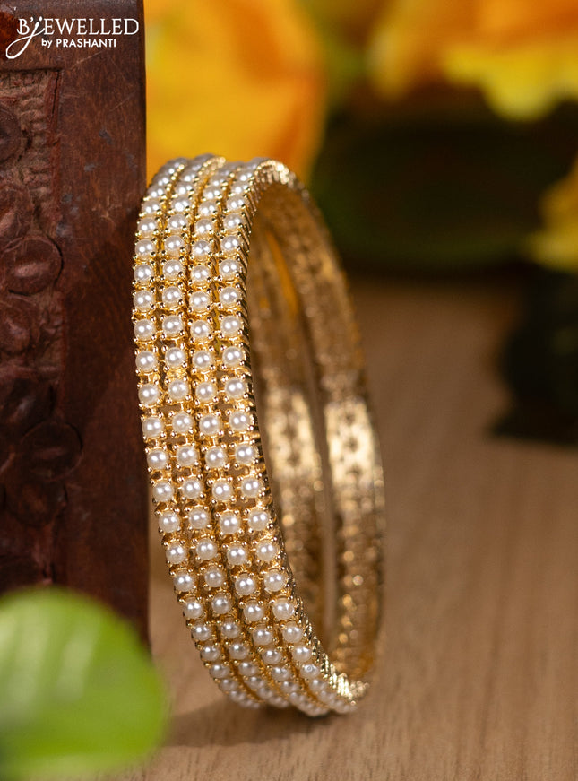 Pearl bangles with pearls in gold finish