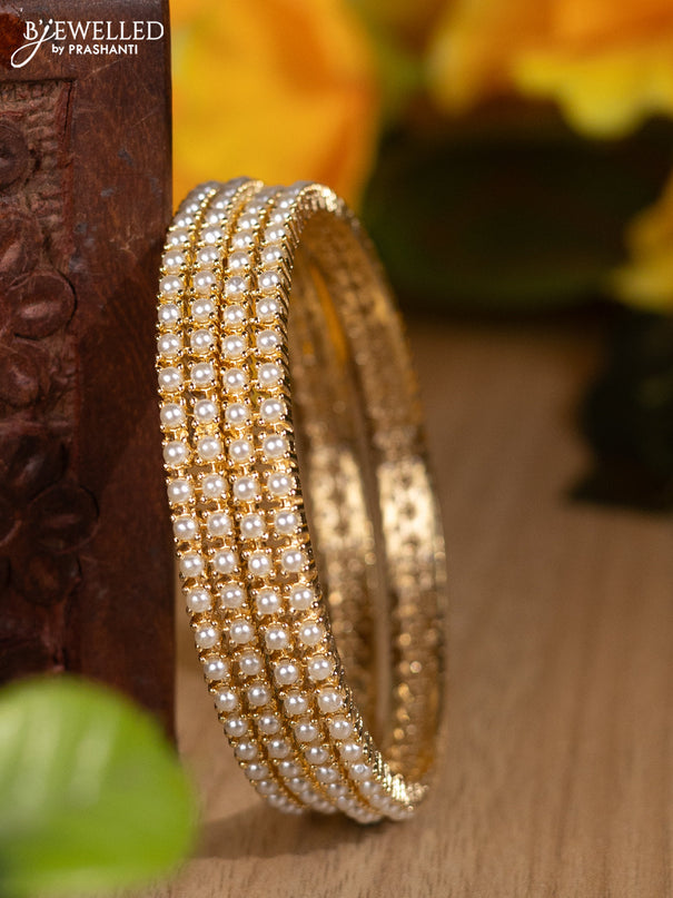 Pearl bangles with pearls in gold finish