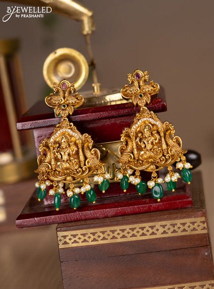 Antique screw type earrings lakshmi design with kemp & cz stones and pearl & green beads hanging