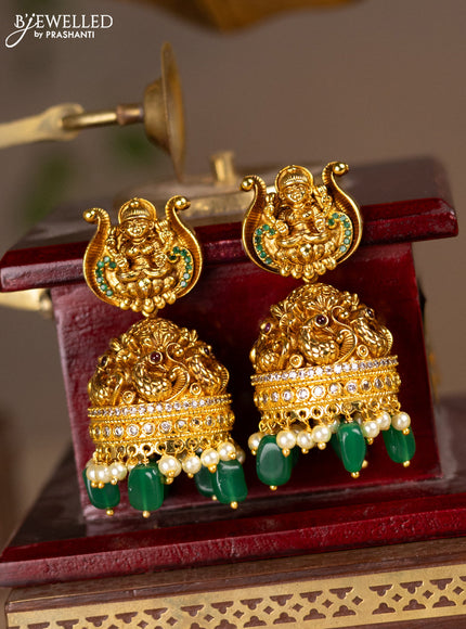 Antique jhumkas lakshmi design with kemp & cz stones and pearl & green beads hanging