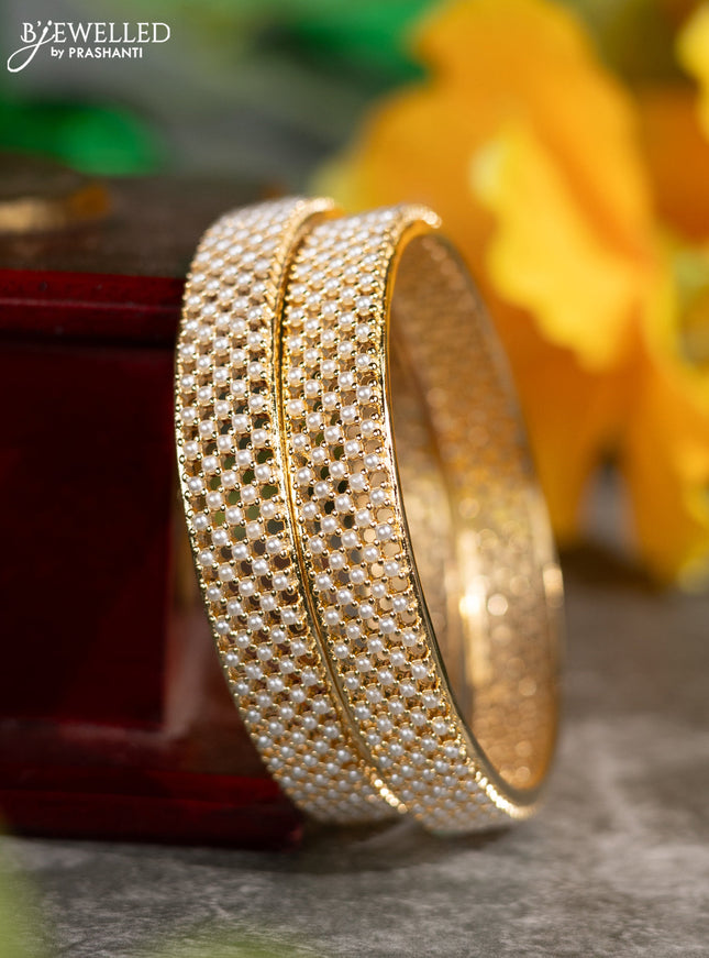 Pearl bangles with pearls in gold finish