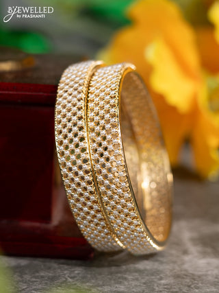 Pearl bangles with pearls in gold finish