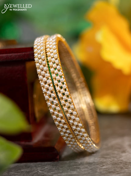 Pearl rajawadi bangles with pearls in gold finish