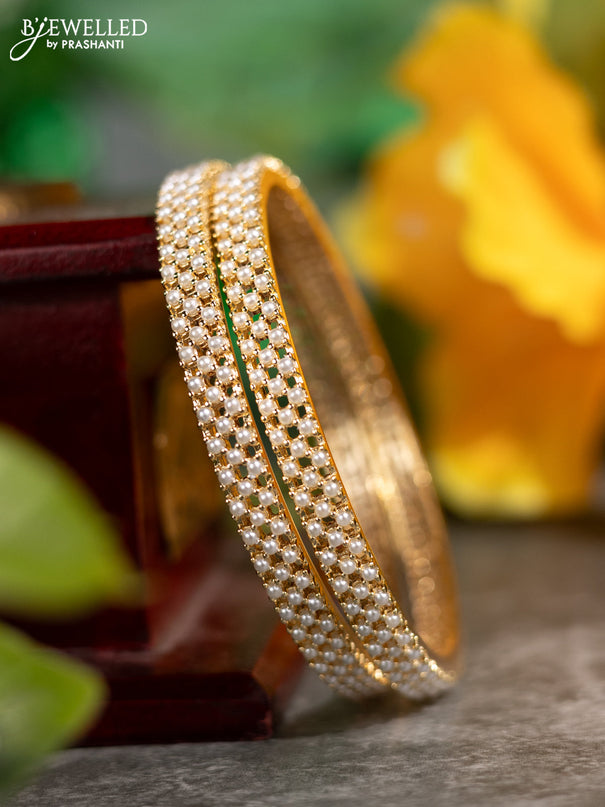 Pearl bangles with pearls in gold finish