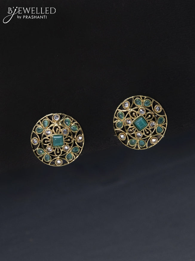 Fashion dangler floral design earrings with cz and light blue stone
