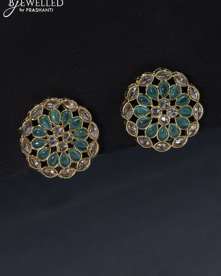 Fashion dangler floral design earrings with cz and emerald stone