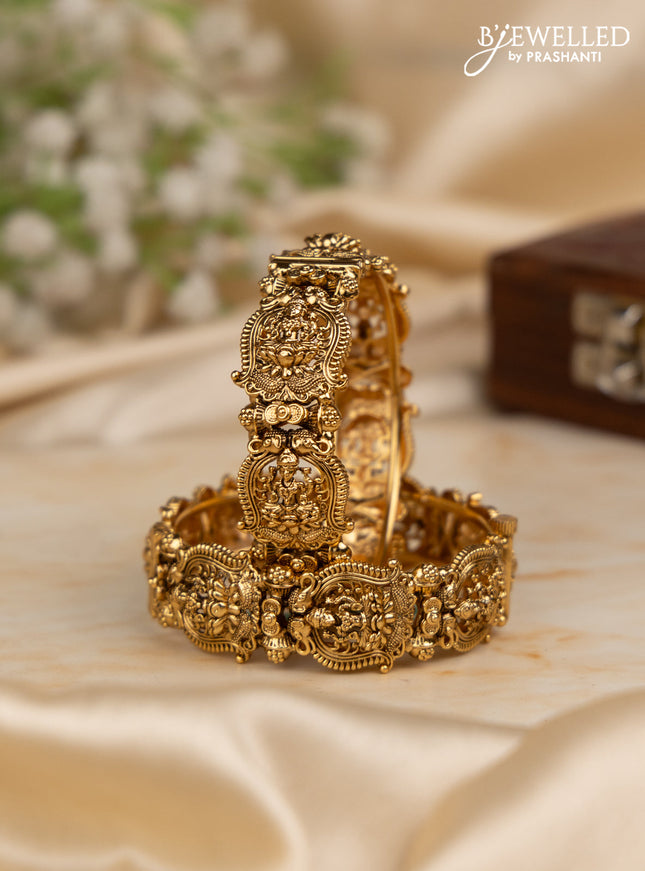 Antique screw type bangles with lakshmi design