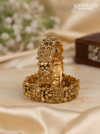 Antique screw type bangles with lakshmi design