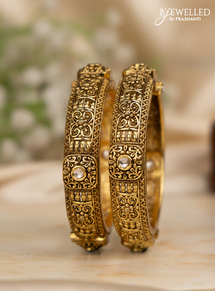 Antique screw type bangles with kundan stones