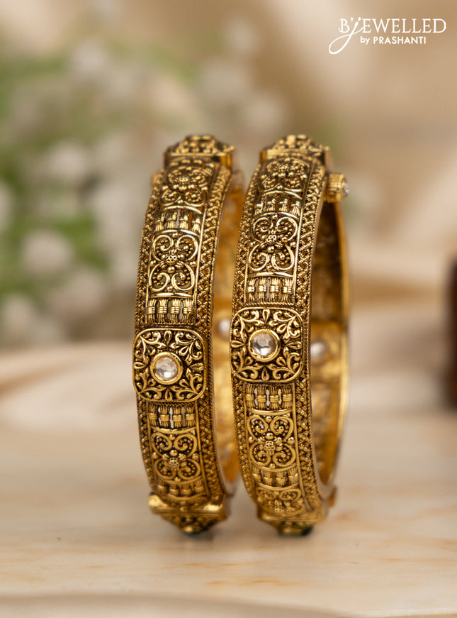 Antique screw type bangles with kundan stones