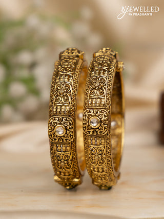 Antique screw type bangles with kundan stones