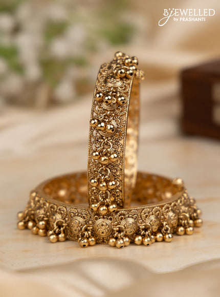 Antique screw type bangles with golden beads hangings