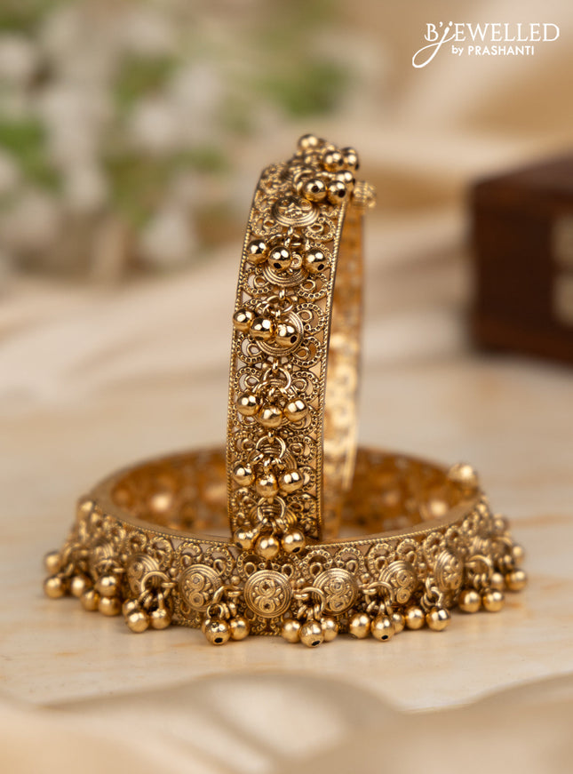 Antique screw type bangles with golden beads hangings