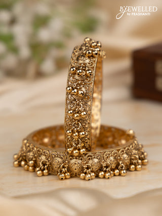 Antique screw type bangles with golden beads hangings