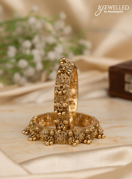Antique screw type bangles with golden beads hangings