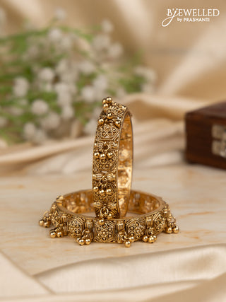Antique screw type bangles with golden beads hangings