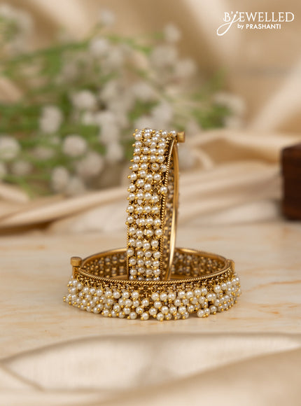 Antique screw type bangles with pearl hangings