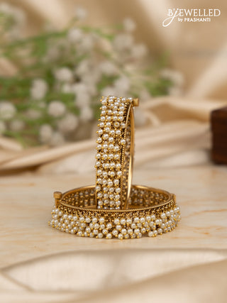 Antique screw type bangles with pearl hangings