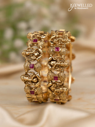 Antique screw type bangles with ganesha design and ruby stones