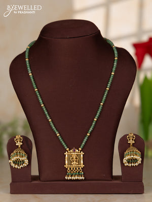 Beaded necklace with antique lakshmi pendant in green beads