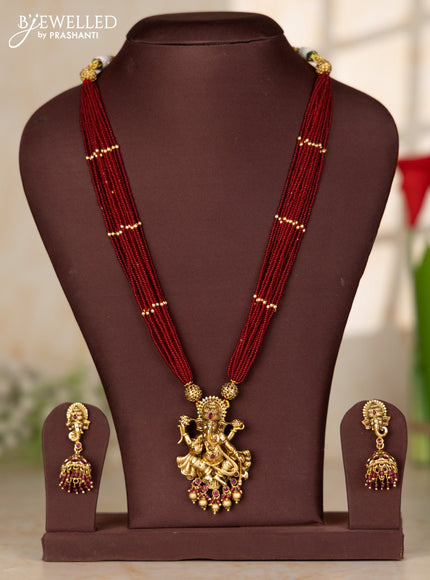 Beaded red multilayer haaram with ganesha pendant in kemp stones and golden ball hanging