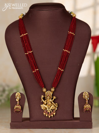 Beaded red multilayer haaram with ganesha pendant in kemp stones and golden ball hanging