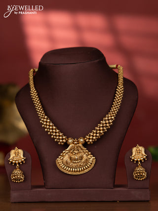 Antique golden beads type necklace with lakshmi pendant completly in gold