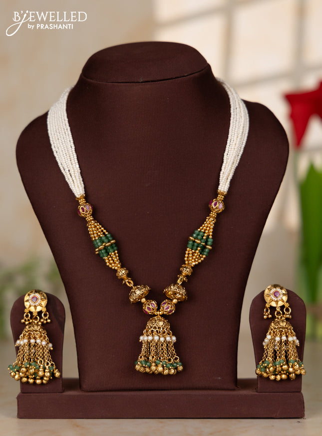 Beaded white multilayer necklace with antique jhumka pendant in red color kemp stones
