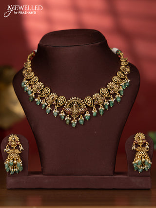 Antique necklace with peacock deisgn in red kemp stones and green beads hanging