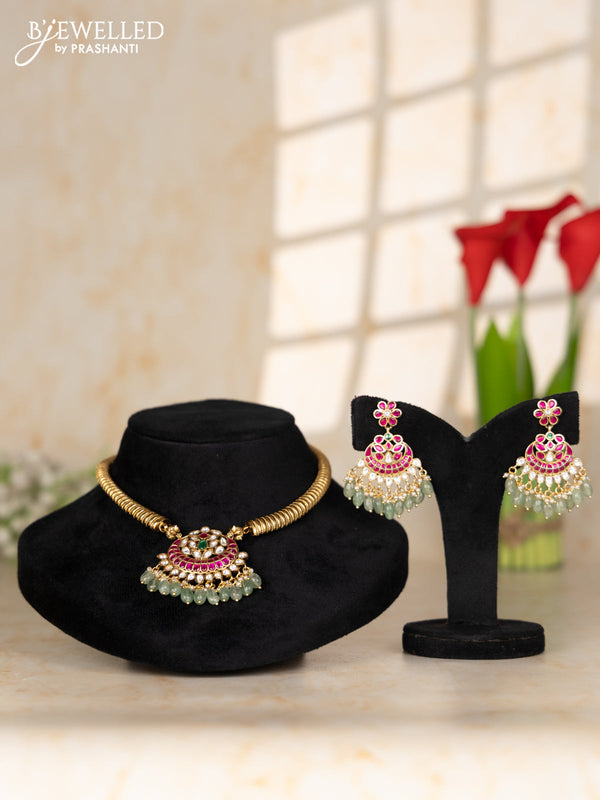 Ring type choker with floral pendant in jadau kundan stones and mint green beads hanging