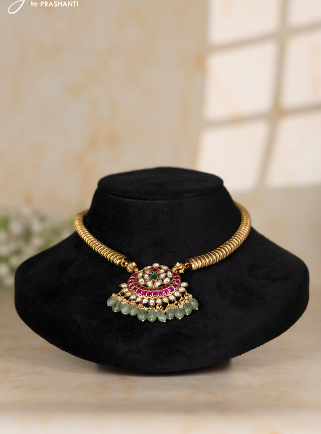 Ring type choker with floral pendant in jadau kundan stones and mint green beads hanging