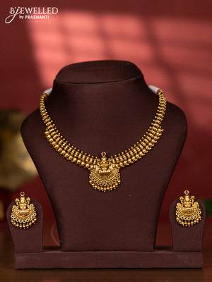Ring type choker with lakshmi pendant in red kemp stones and golden beads hanging