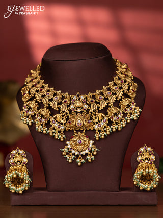 Antique necklace with double peacock and raja rani deisgn in kemp and white stones and pearl beads hanging